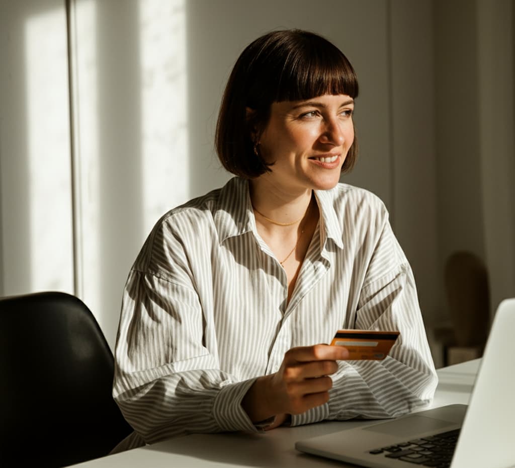Woman holding a credit card